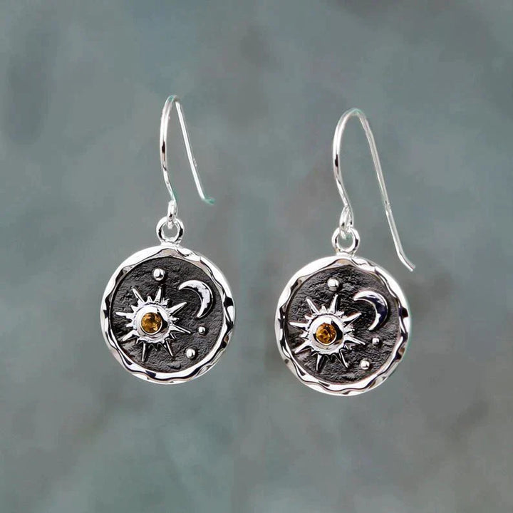 Boho oorbellen met zon en maan ontwerp