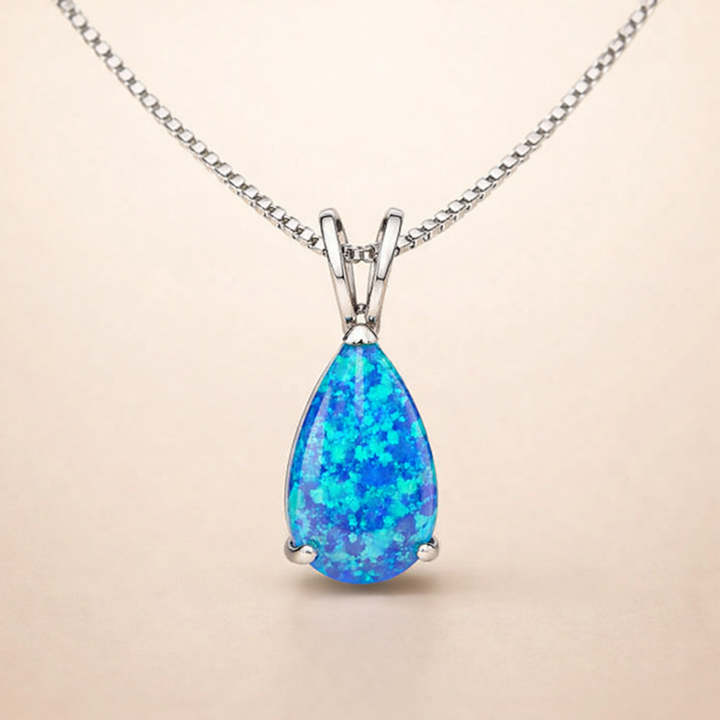 Zachte druppelketting van wit goud met opaal accent