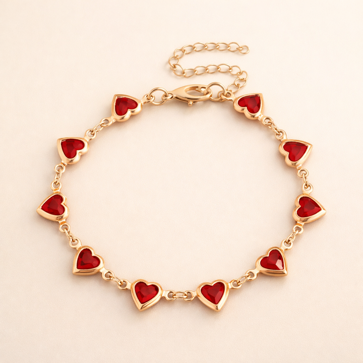 Elegante gouden armband met subtiele garnet steentjes