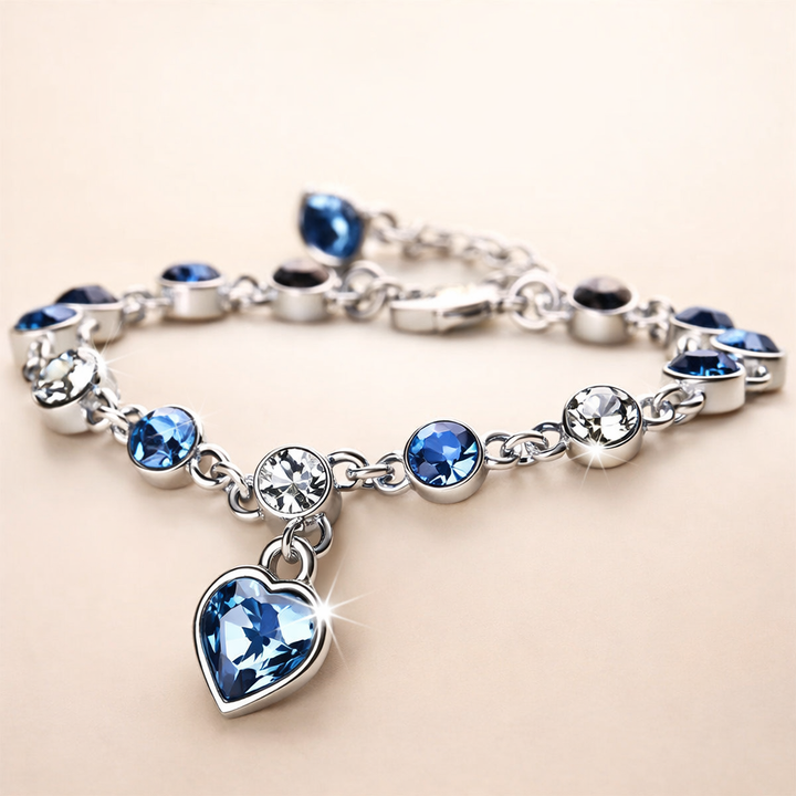 Zachte glans armband van wit goud met hartje.