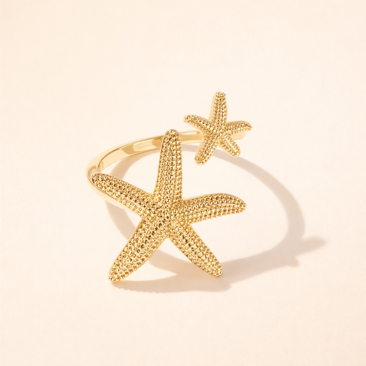 Elegante zeester ring in zilver met gouden accenten