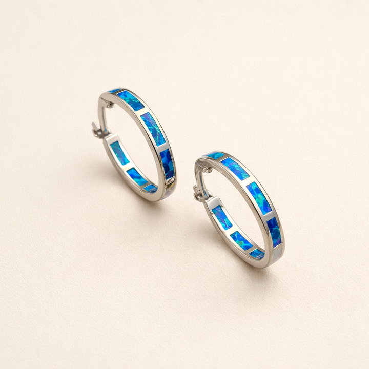 Elegante zilveren oorbellen met opaal in oceaanstijl
