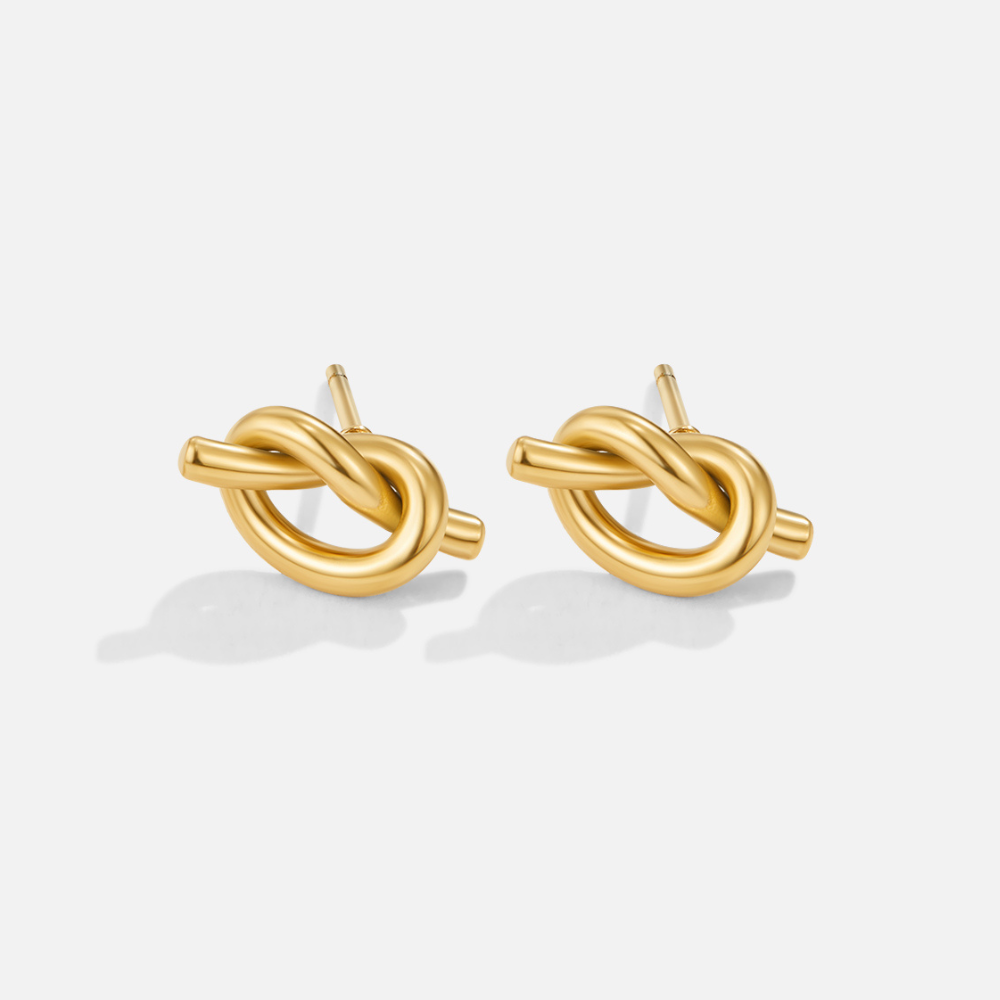 Elegante zilveren oorbellen met verfijnde knoopdetails