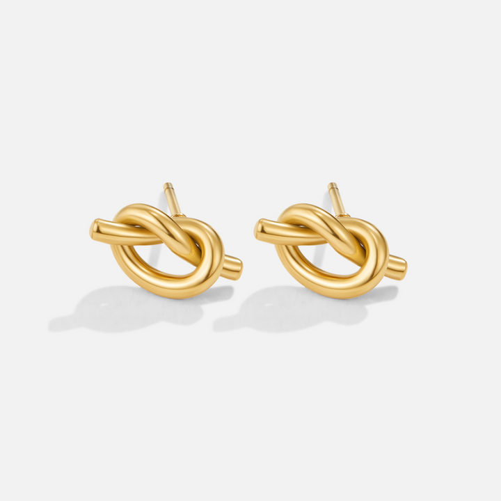 Elegante zilveren oorbellen met verfijnde knoopdetails