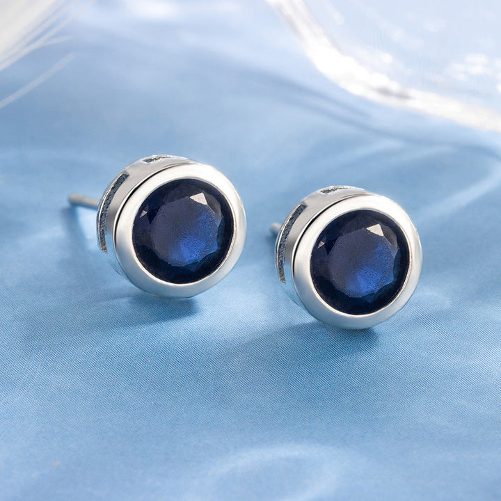 Elegante oorbellen van wit goud met saffier zetting