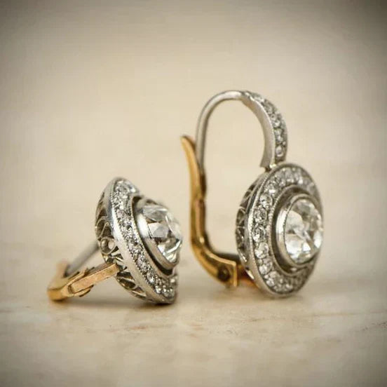 Elegante zilveren oorbellen met zirkonia en gouden accenten