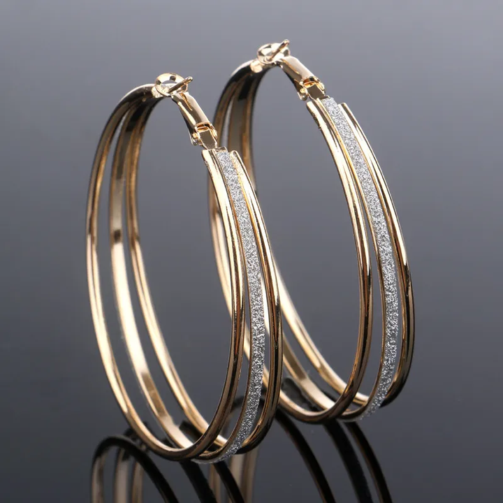 Glanzende vintage gouden oorbellen