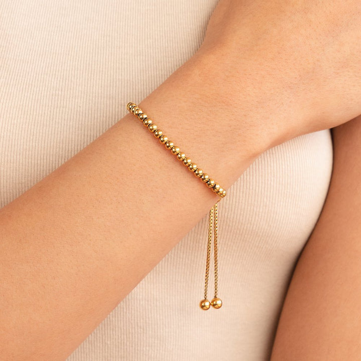 Elegante armband van goud met pareldetails
