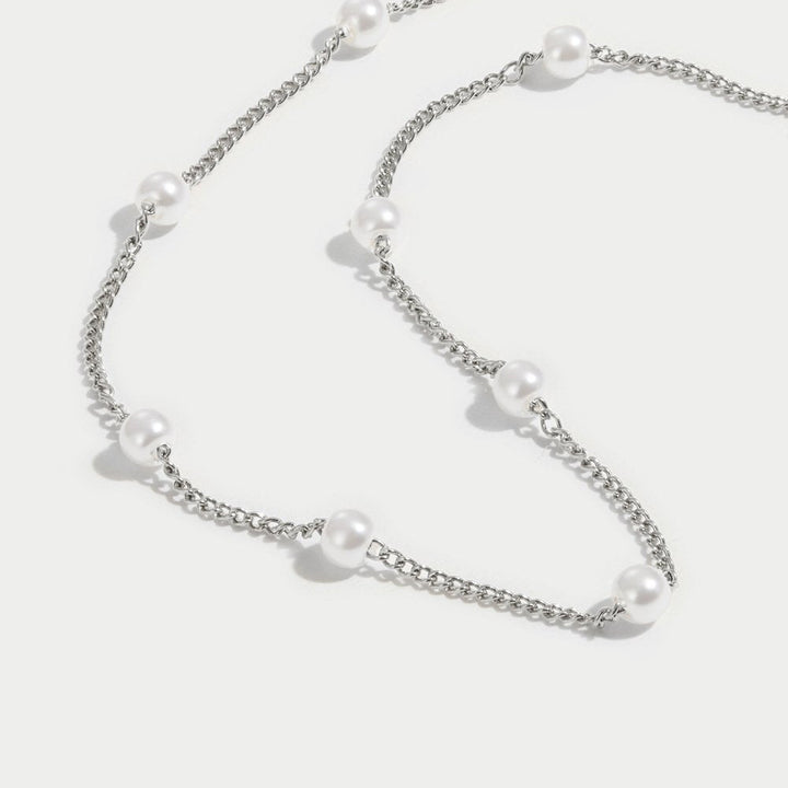 Elegante zilveren ketting met parel en verfijnde details