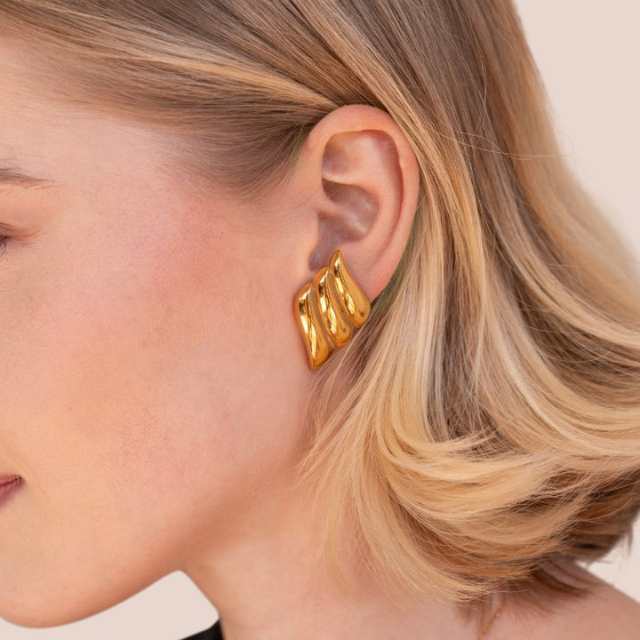 Elegante gouden oorbellen met verfijnde ronde vormen