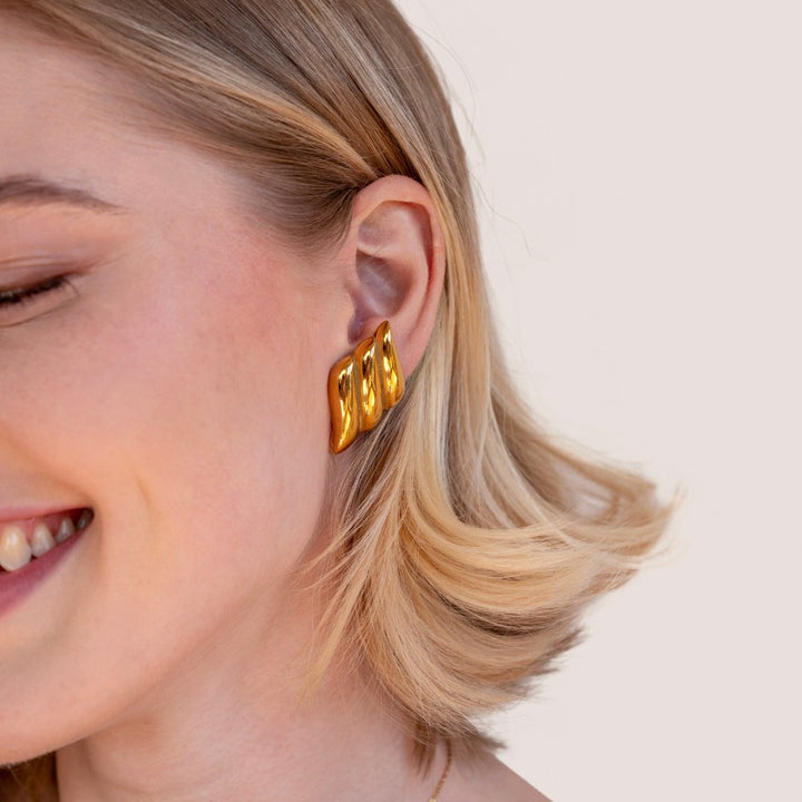 Elegante gouden oorbellen met verfijnde ronde vormen