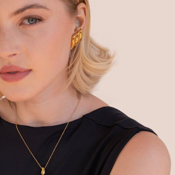 Elegante gouden oorbellen met verfijnde ronde vormen